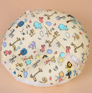 Baby play mat with colorful animal patterns on a beige background