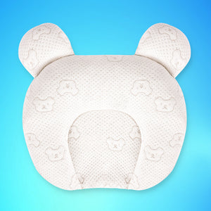White baby head support pillow with bear ears on a blue background