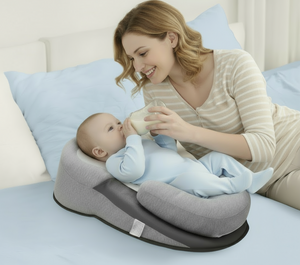 Woman feeding a baby on a baby seat in a bedroom setting