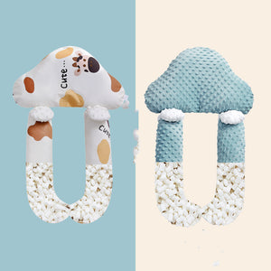 Two baby teething toys with animal designs on a light blue and beige background