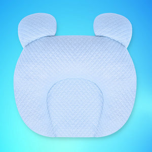 Blue baby pillow with bear ears on a blue background