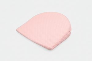 Pink baby hat on a light gray background