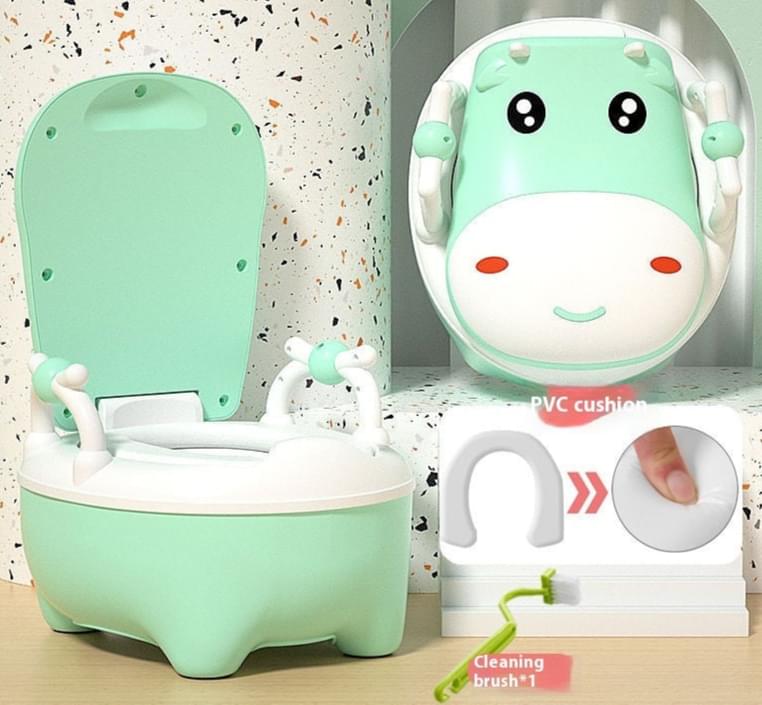 Two cow-themed potty chairs for toddlers, one in pink and one in blue, each with a soft seat cover and a closed lid.