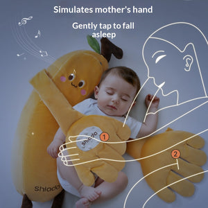 Baby lying on a plush toy resembling a mother's hand with text indicating it simulates a mother's hand and gently taps to fall asleep.