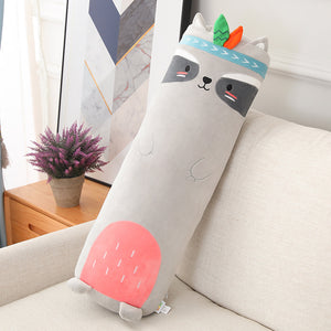 Cylindrical pillow with cartoon face design on a couch