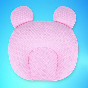 Pink pillow with bear ears on a blue background