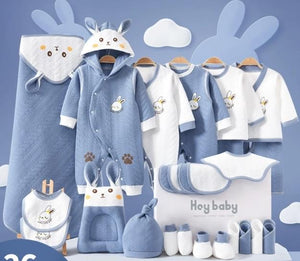 Collection of baby clothing and accessories with cartoon rabbit design on a blue background.