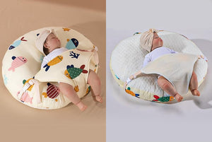 A newborn lounger pillow with a printed design, featuring a baby lying on it in a supine position.