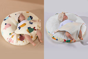 A newborn lounger pillow with a printed design, featuring a baby lying on it in a supine position.