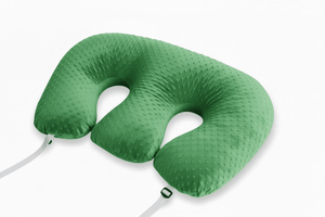 Green travel neck pillow on a white background