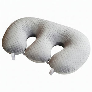 Silver U-shaped travel pillow on a white background
