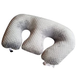 Silver U-shaped travel pillow on a white background