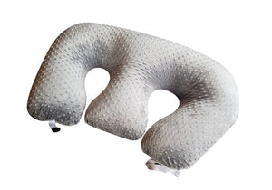 U-shaped travel pillow with textured surface on a white background