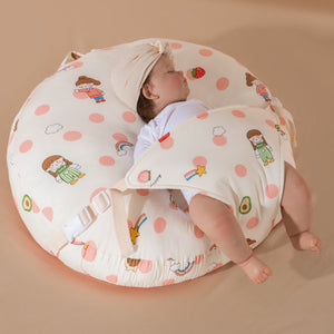 A newborn lounger pillow with a printed design, featuring a baby lying on it in a supine position.