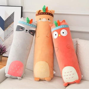Three animal-themed body pillows on a couch in a living room setting.