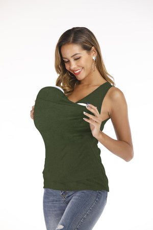 Woman wearing a green sleeveless top with a white lining on a white background