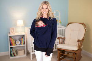 Woman wearing a navy blue hoodie with a red and white pattern on a white background