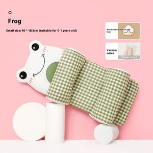 Frog-shaped product with green checkered pattern on a pink background