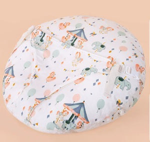 Round pillow with cartoon animal design on a beige background