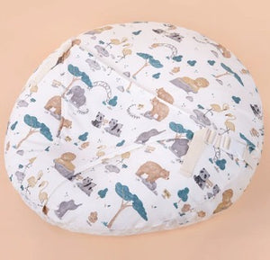 Round cushion with animal pattern on a beige background