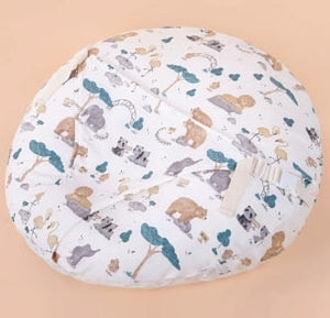 Round cushion with animal pattern on a beige background