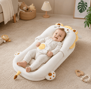 Baby lying on a lion-shaped cushion in a cozy room with toys around