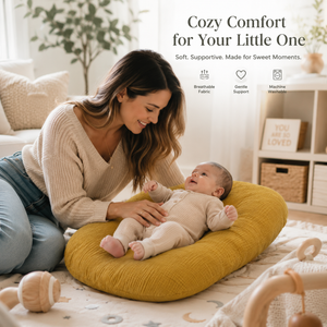Woman holding a baby on a yellow cushion with text 'Cozy Comfort for Your Little One' in a home setting.