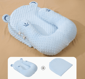 Blue baby pillow with waffle texture on a beige background