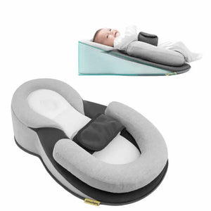 Baby lounger pillow with a baby lying on it on a white background