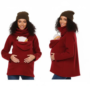 A collage of three images showing a woman modeling a black kangaroo hoodie with a baby inside the kangaroo pocket. The hoodie is designed for hands-free carrying of a baby.