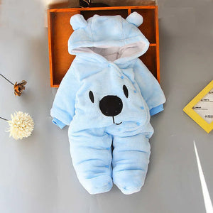 A beige Disney Winnie-the-Pooh winter jumpsuit for babies, featuring a hood with ears, footed design, and a smiling Winnie-the-Pooh face on the front.