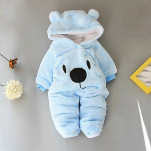 A beige Disney Winnie-the-Pooh winter jumpsuit for babies, featuring a hood with ears, footed design, and a smiling Winnie-the-Pooh face on the front.