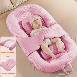 A newborn infant baby lounger bed in pink color, designed with anti-reflux and anti-colic features, including a folding bed in bed mode and an anti-spill milk out feature.