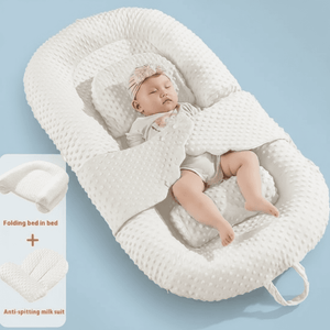 A newborn infant baby lounger bed in white color, designed with anti-reflux and anti-colic features, including a folding bed in bed mode and an anti-spill milk out feature.