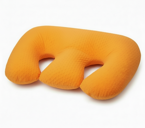 Orange twin nursing pillow on a white background
