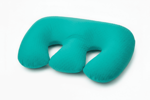 Turquoise U-shaped travel pillow on a white background