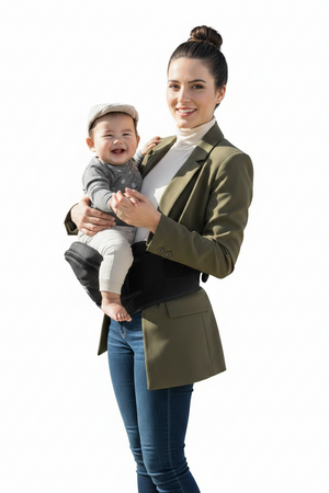 Woman holding a baby in a black baby carrier against a white background