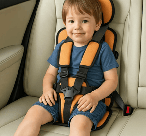 Child sitting in a car seat with orange and black straps