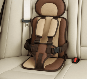 Brown and beige car seat for children on a beige car seat cover