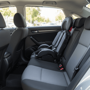 Black and gray child safety seat on a white background