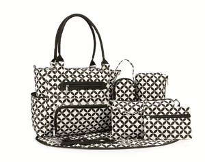 Black and white geometric patterned diaper bag set on a white background