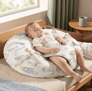 Baby sleeping on a cushion with space-themed design in a cozy room.