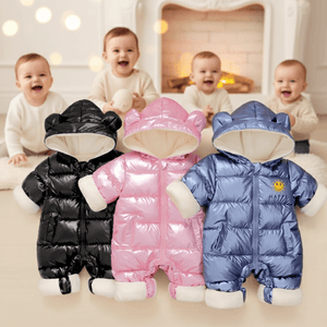 Three baby rompers in black, pink, and blue with a baby in the background.