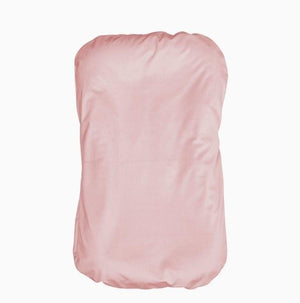 Pink strapless top on a white background