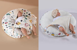 A newborn lounger pillow with a printed design, featuring a baby lying on it in a supine position.