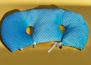 Blue travel pillow on a yellow background