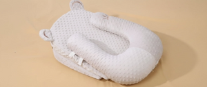 White textured pillow on a beige background