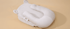 White textured pillow on a beige background