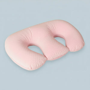 Pink U-shaped pillow on a white background