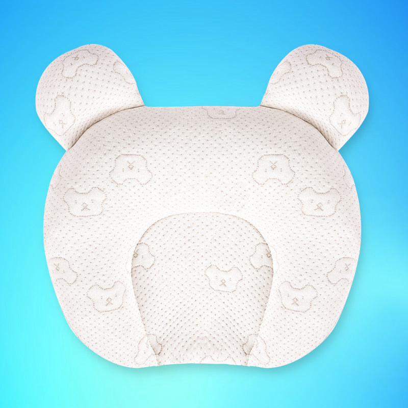 White baby head support pillow with bear ears on a blue background